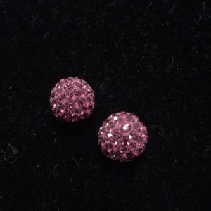 Two dark pink Swarovski crystal beads